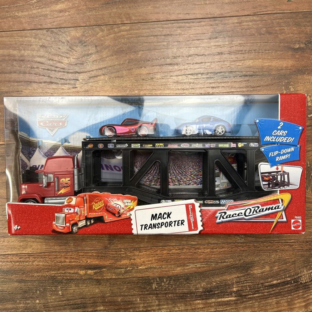 DISNEY PIXAR THE WORLD OF CARS. MACK TRANSPORTER  RACE-O-RAMA RARE!!! New in Box